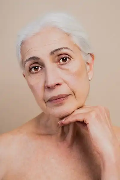 Senior woman portrait with hand on chin